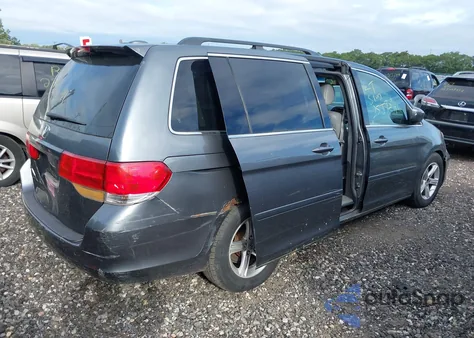 2010 Honda Odyssey Ex-L z USA, uszkodzony, nr VIN 5FNRL3H70AB021452